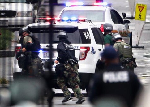 Law enforcement personnel respond to a reported shooting at the Washington Navy Yard September 16, 2013 in Washington, DC.